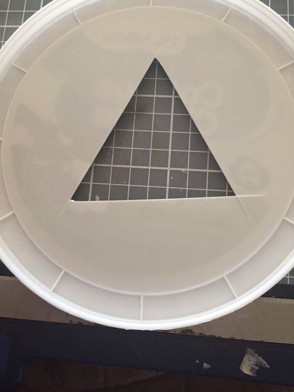 Use the craft knife to cut a triangle in the middle of the lid. (after you look back on Pinterest b/c you can't figure out how to use the punch to work through the lip on lid)