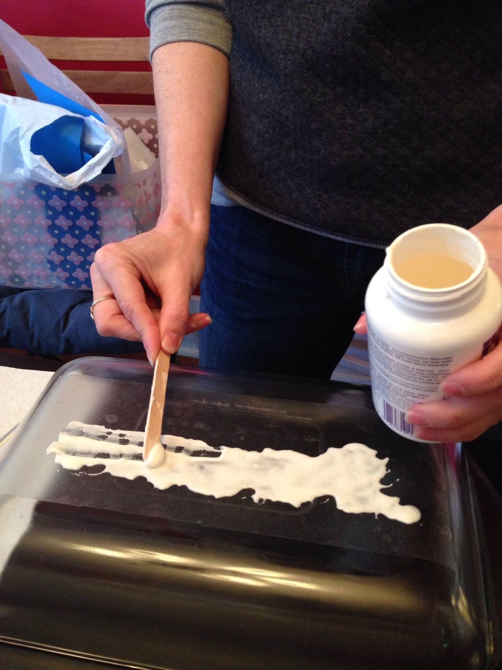Use the craft stick to wipe off the etching cream. We salvaged the extra and placed it back in the bottle.
