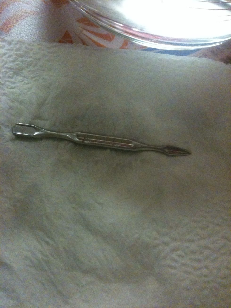 Use the cuticle pusher to remove the nail. Just place the point under the nail and push upwards, the nail will just pop off