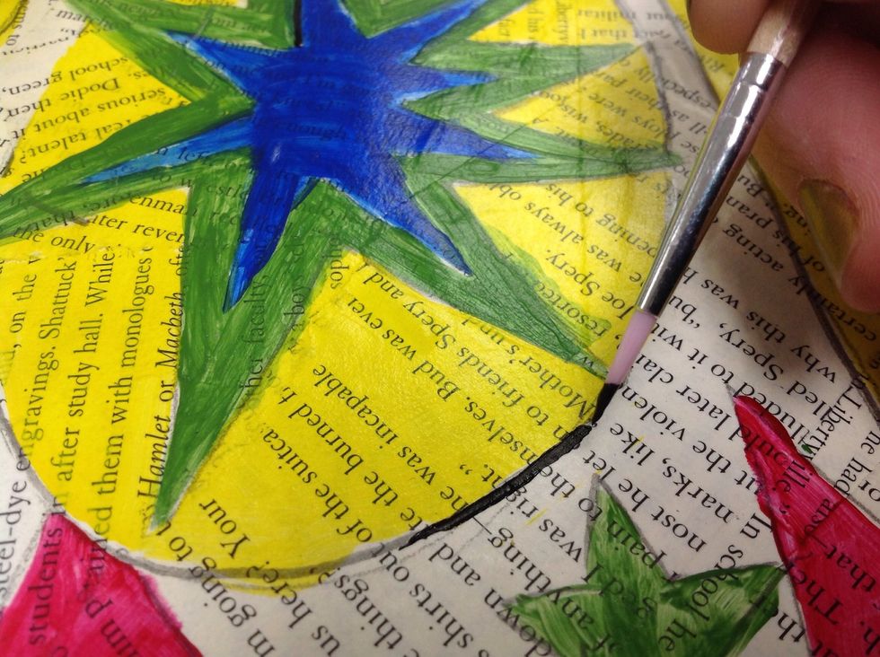 Use the fine tip paintbrush to outline the drawing.