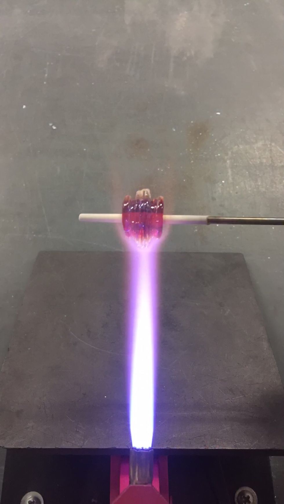 Use the flame to begin melting in the clear rings.