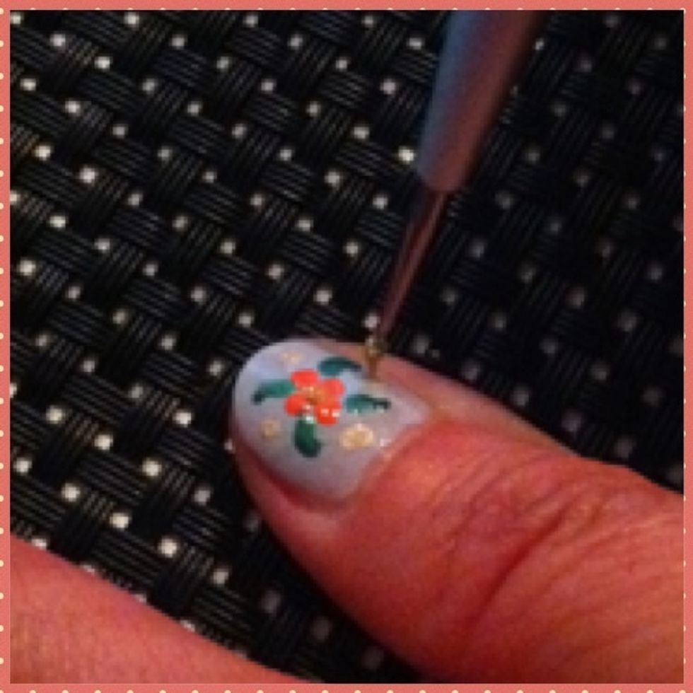 Use the gold colour and tip a few dots here and there :).