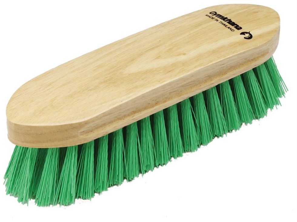 Use the hard brush (the brush with stiffer bristles) to sweep away loose dust and hair. Brush in the horse's hair direction. DO NOT use on face.