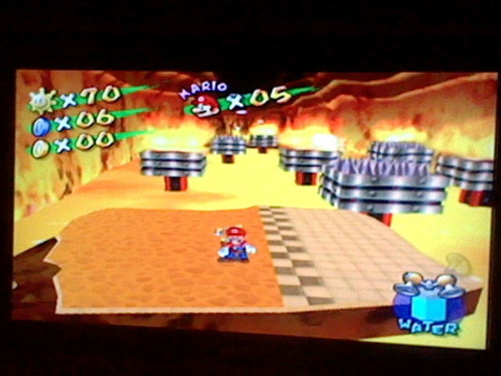 Use the hover nozzle to fly over the next set of spikes and fire.