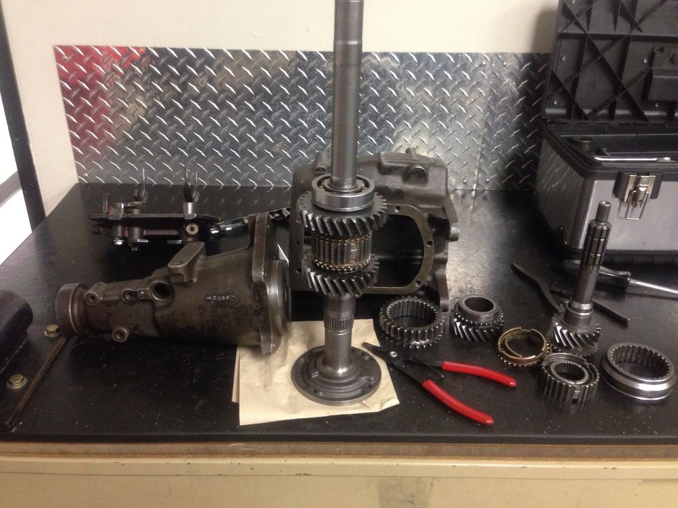 Use the input shaft housing to line up the shaft the gears. Remember the 3th gear then Synchronizer ring then synchronizer hub then synchronizer ring 4th gear then roller bearing