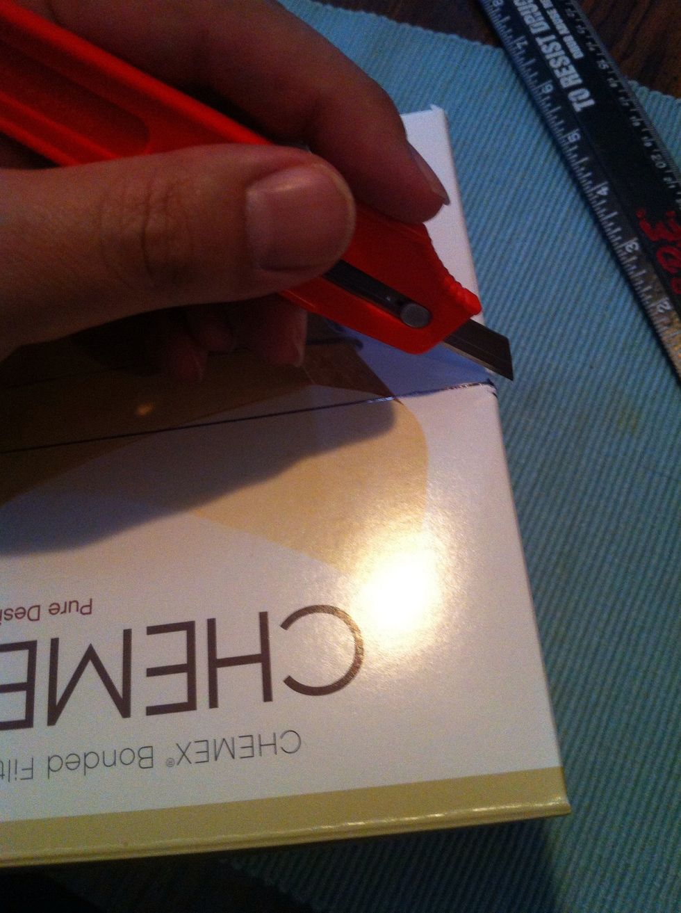 Use the knife to cut the corners. This is the toughest part of the cardboard and scissors just might not "cut it." Haha.