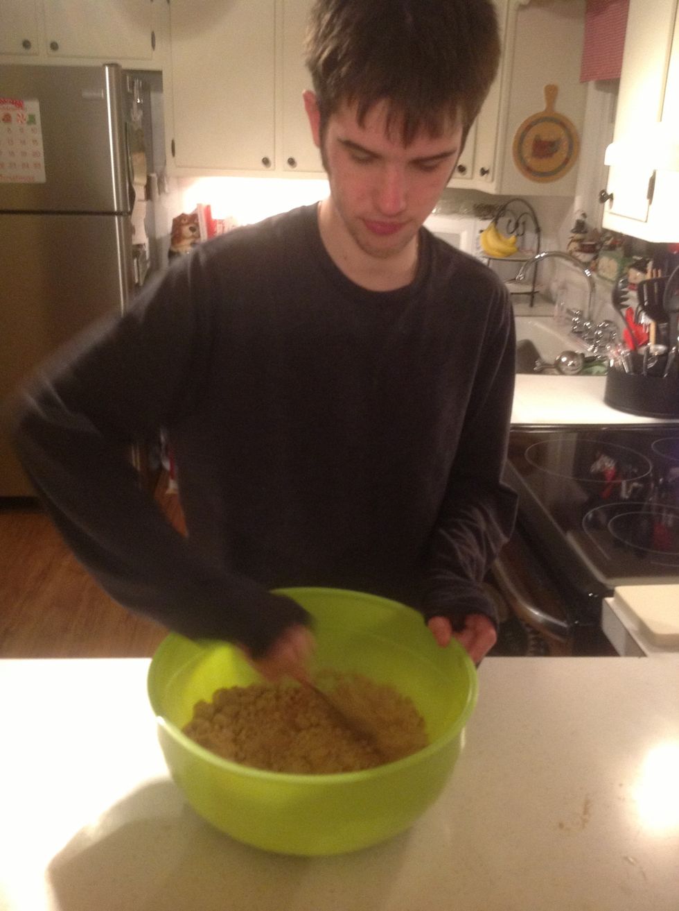 Use the large spoon to combine all of the ingredients.