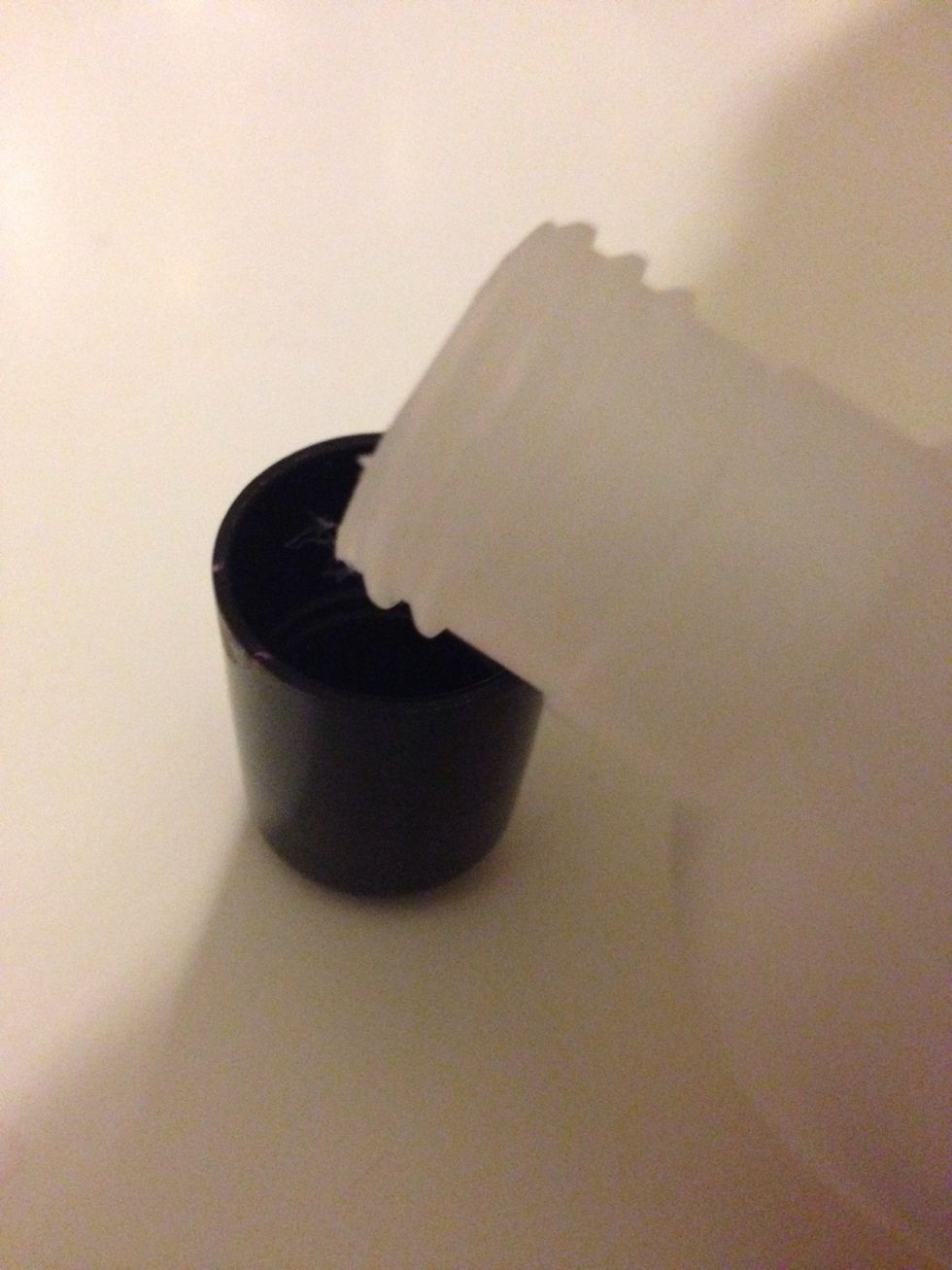 Use the lid of the nail polish to pour into the remover. *NOTE*, if the gloopier the nail varnish, the more you'll need. However, it is a very small amount