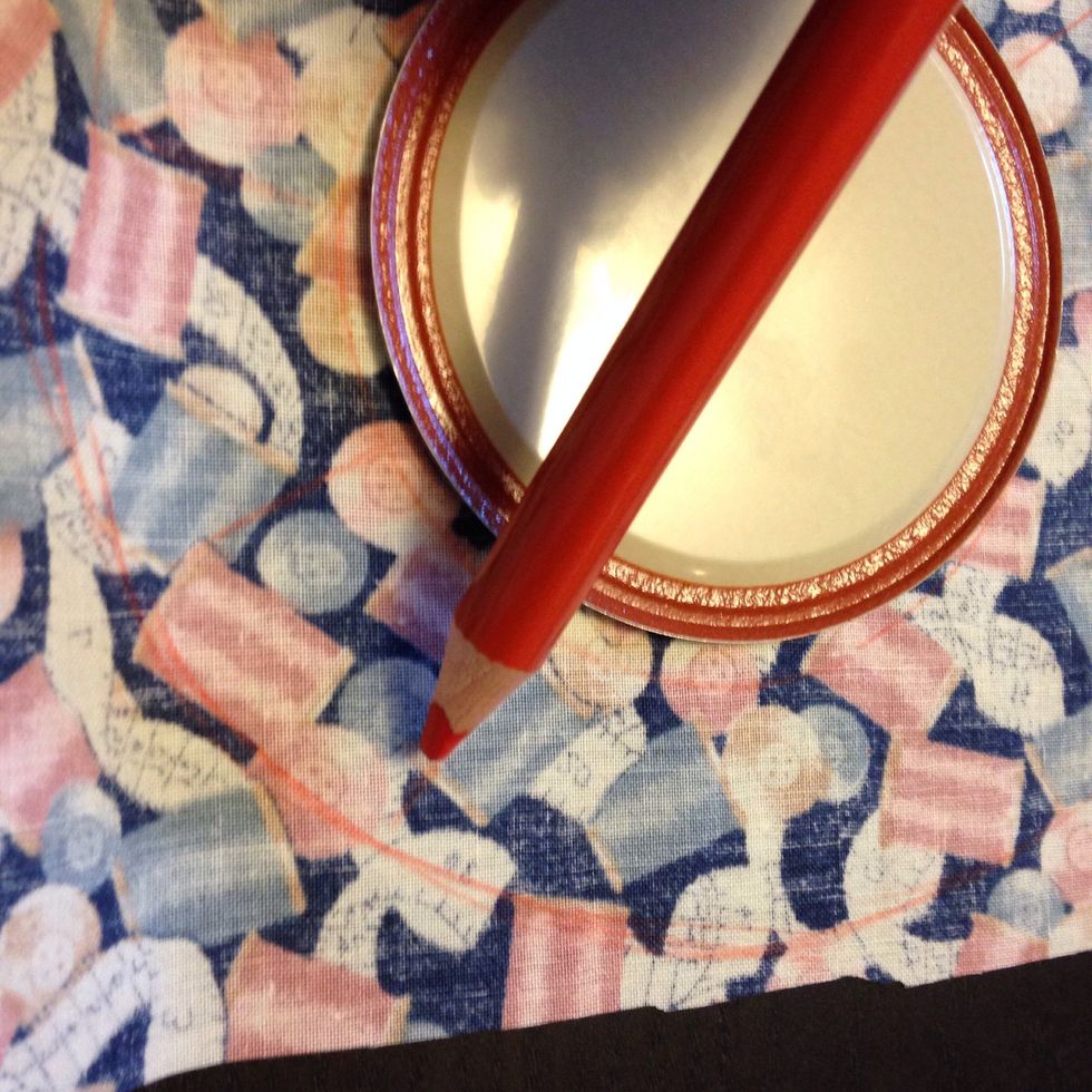 Use the lid to draw a circle around the lid. Cut out that circle.