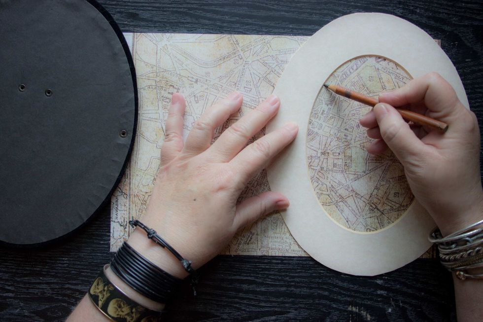 Use the lighter colored paper to create the background: