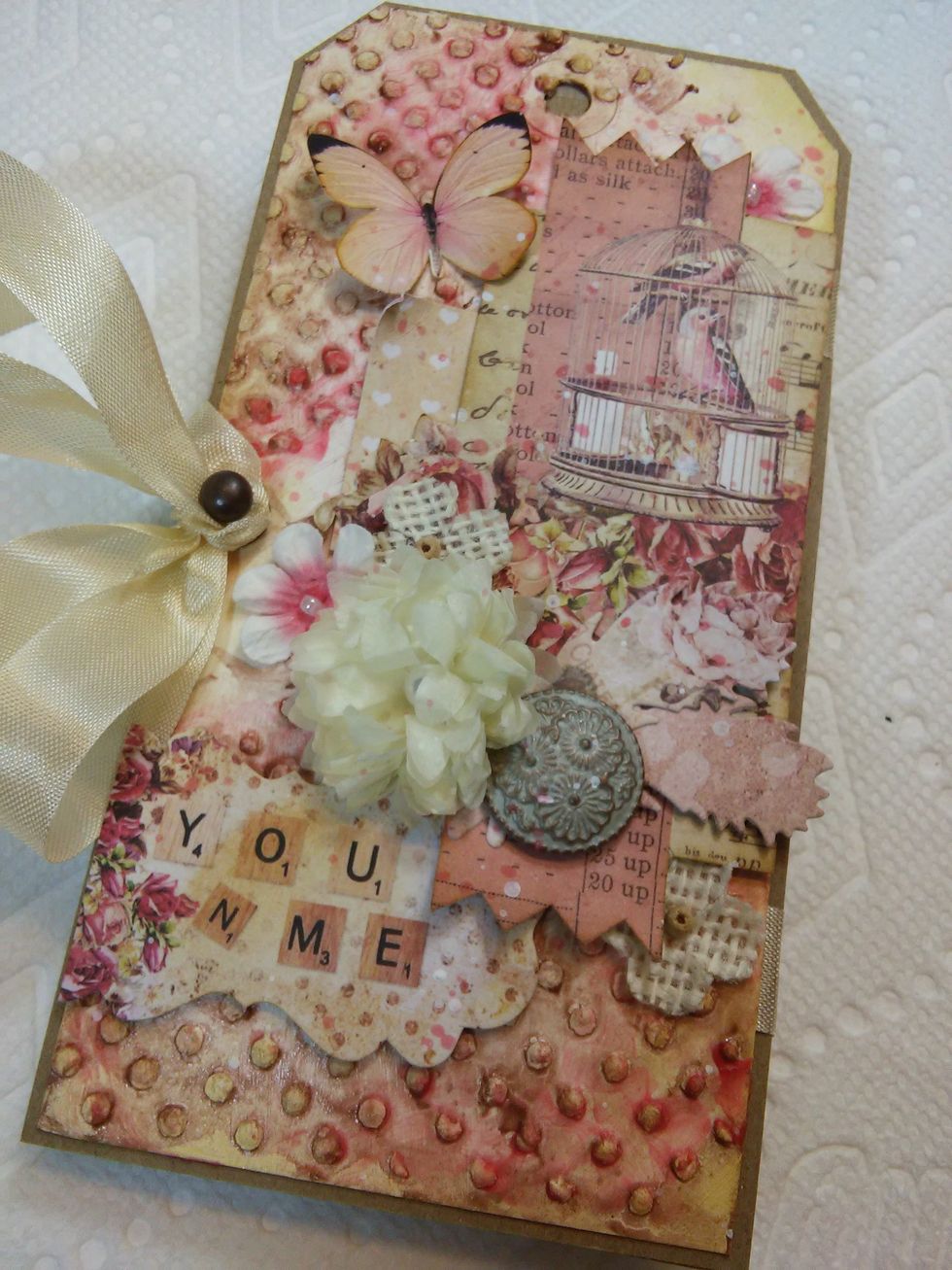 Use the little hardware knob to tie the ribbon around and you're all done!