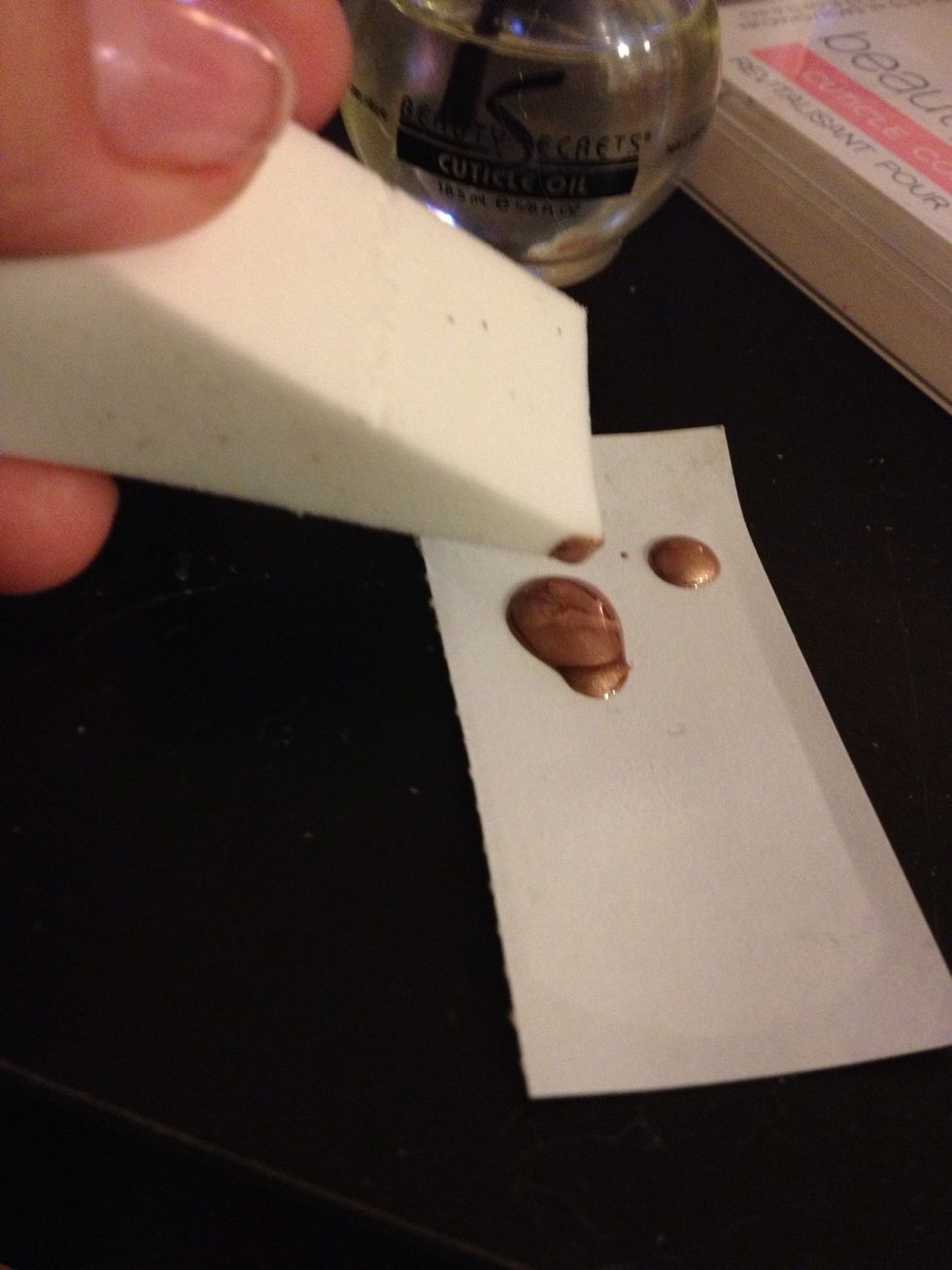 Use the makeup sponge and dab a little bit on the corner...