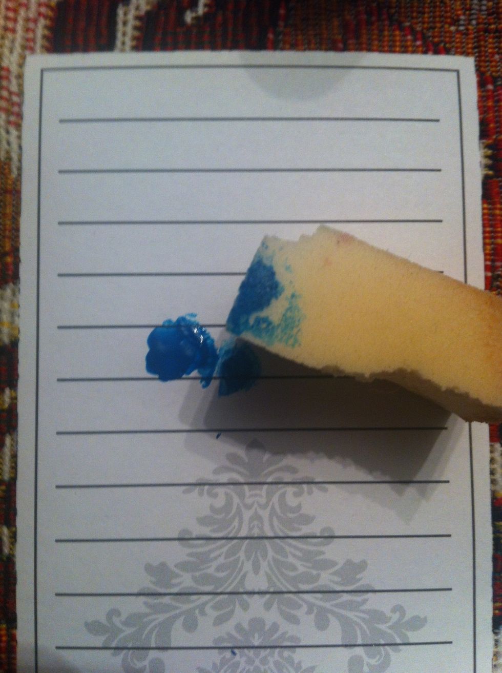 Use the makeup sponge and slowly dab the blue color onto it
