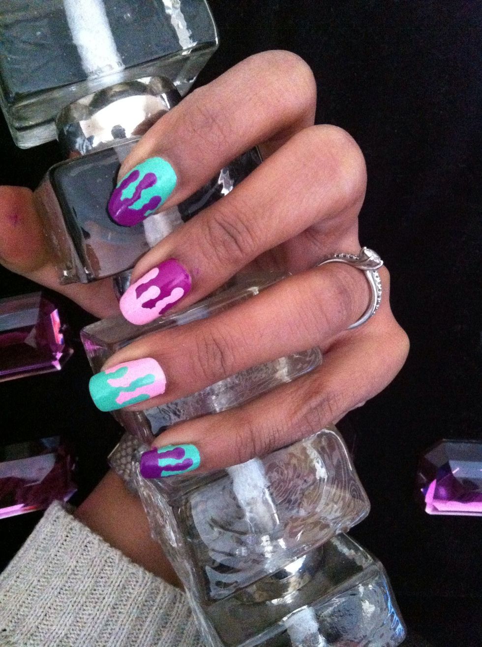 Use the match stick to create the drip start of with a small blob of colour on matchstick futher down the nail then squiggle to the tip (to meet the French mani bit)