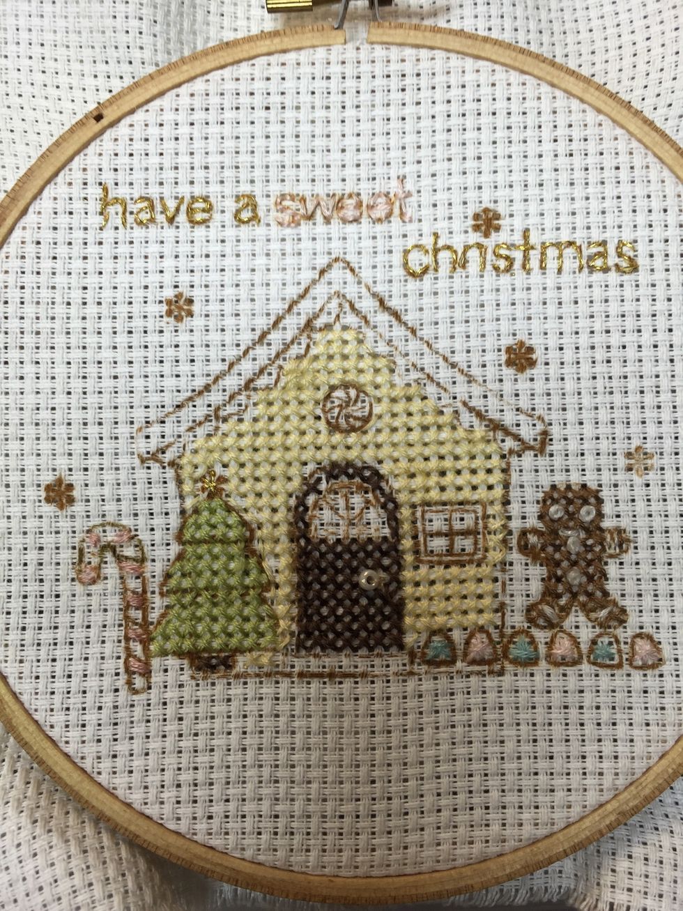 Use the metallic thread to back stitch the title