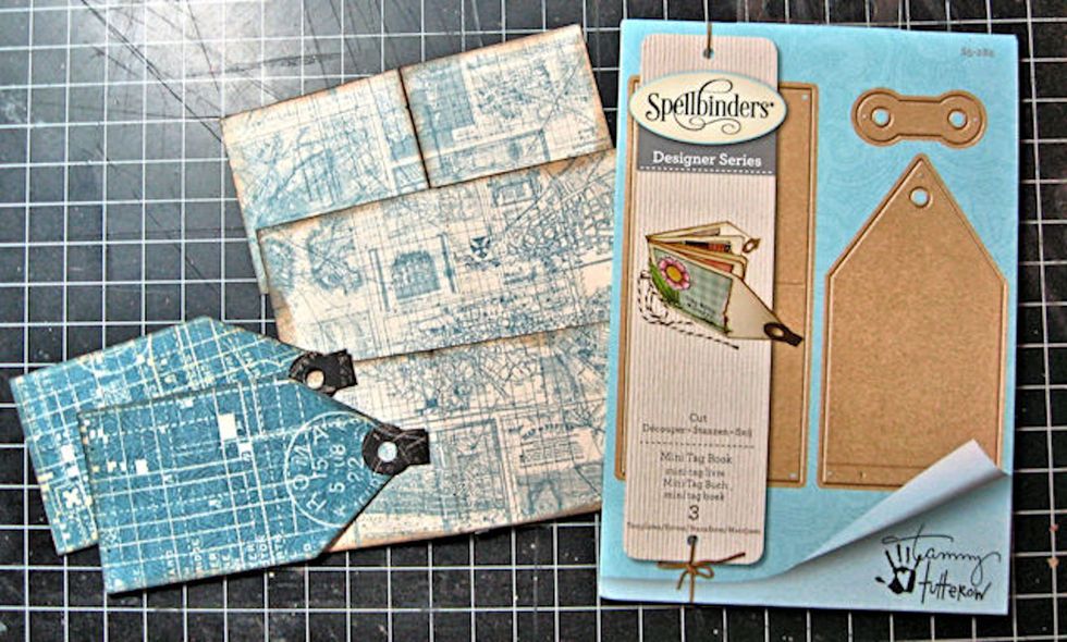 Use the Mini Tag Book die to cut 2 covers, two reinforcement tabs and 3 pages for your book. In this photo, I have folded the reinforcement tabs in half and glued them onto the book covers.