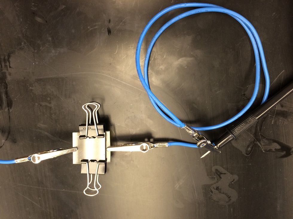 Use the multi meter to test your Gratzel cell. Attached the negative terminal to the edge of the TiO2 coated slide.