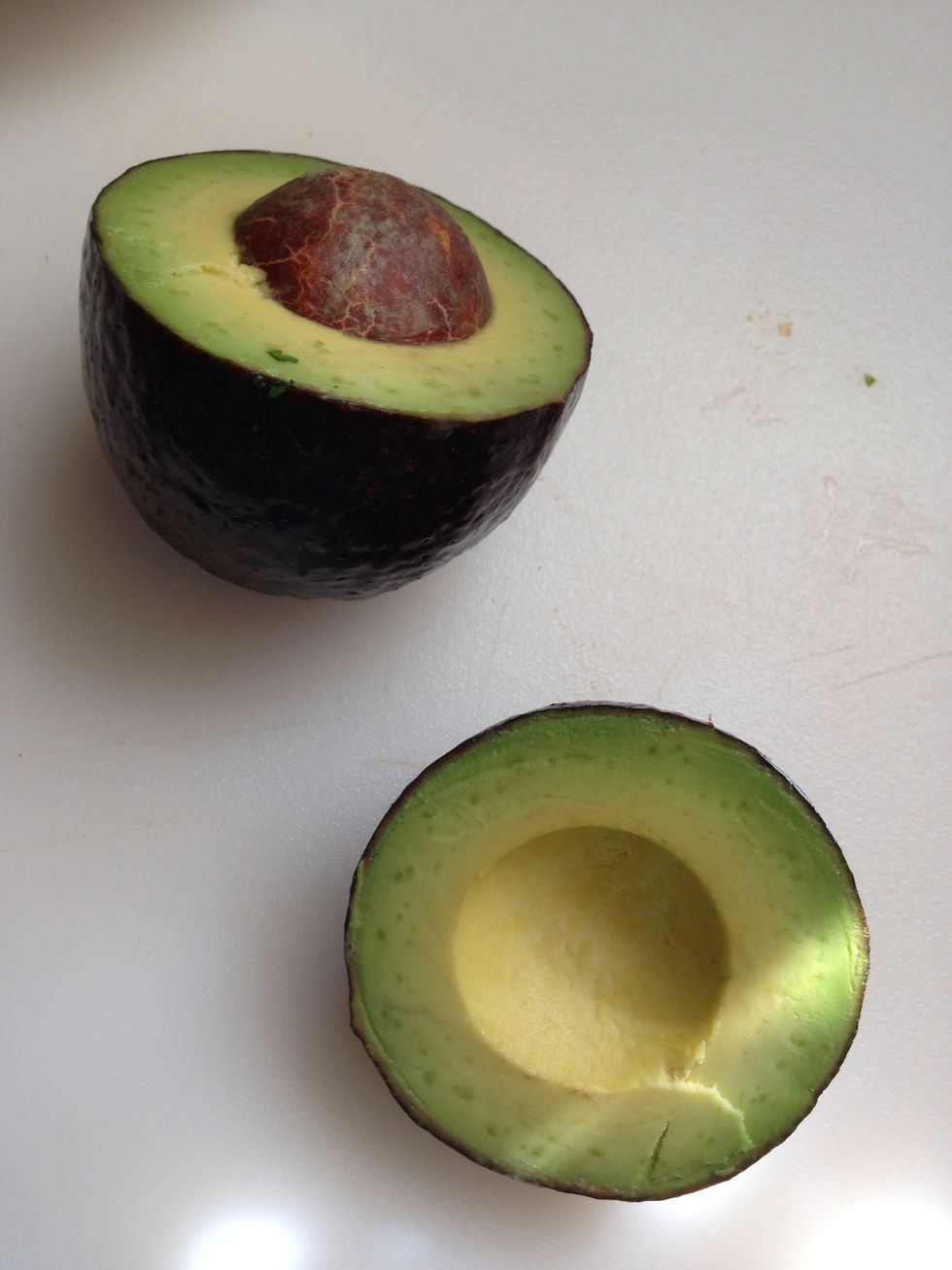 Use the non seeded one. Store other half of avocado in fridge, seed and all,  wrapped.