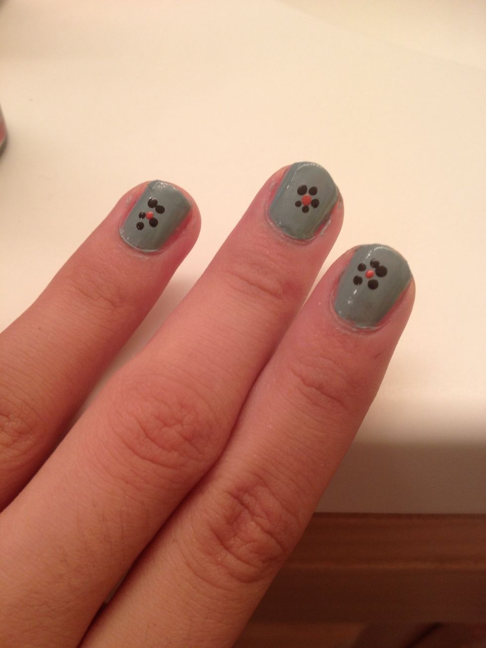 Use the other end of the bobby pin and dip it into your darker color. Dot this in the middle of your petals. This is the center of your flowers.