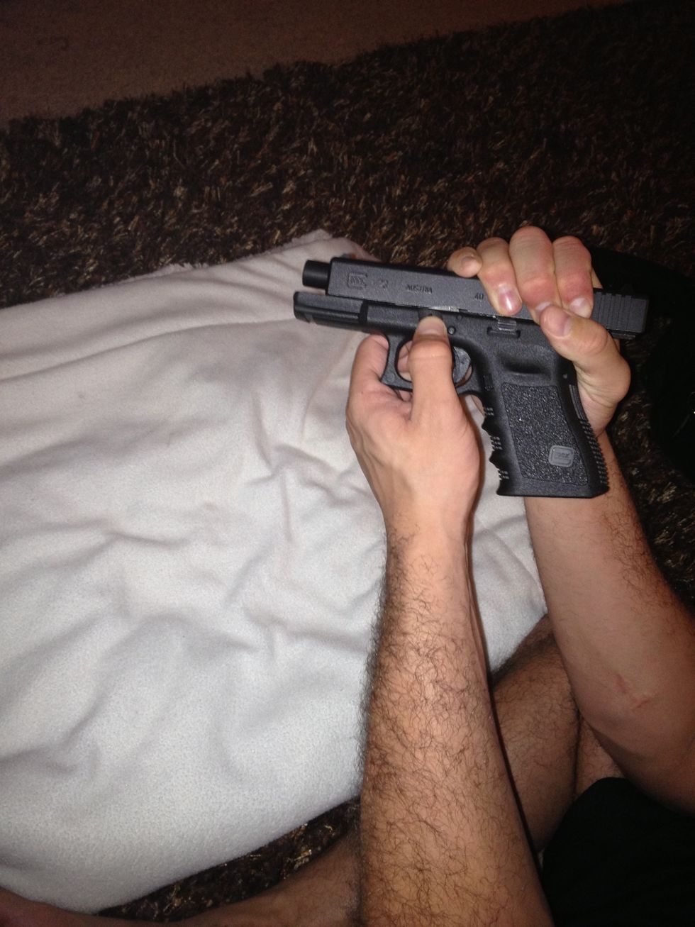 Use the other hand to pull down the two slide releases on each side.