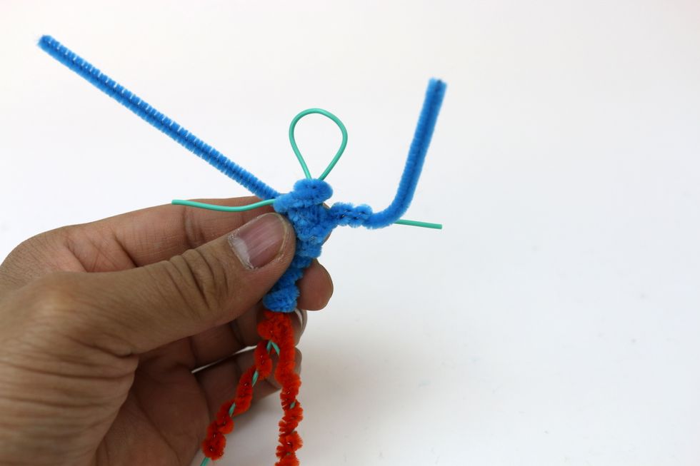 Use the other pipe cleaner to wrap the arms.