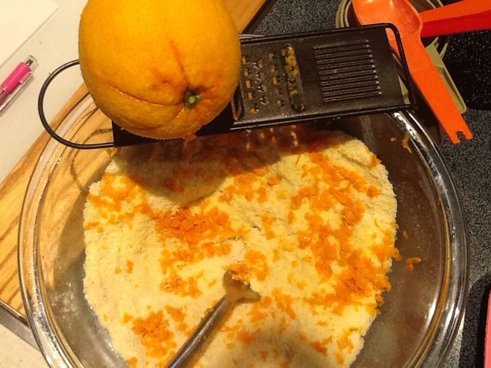 Use the outer orange skin or zest by grating it onto the flour mixture. Mix well.