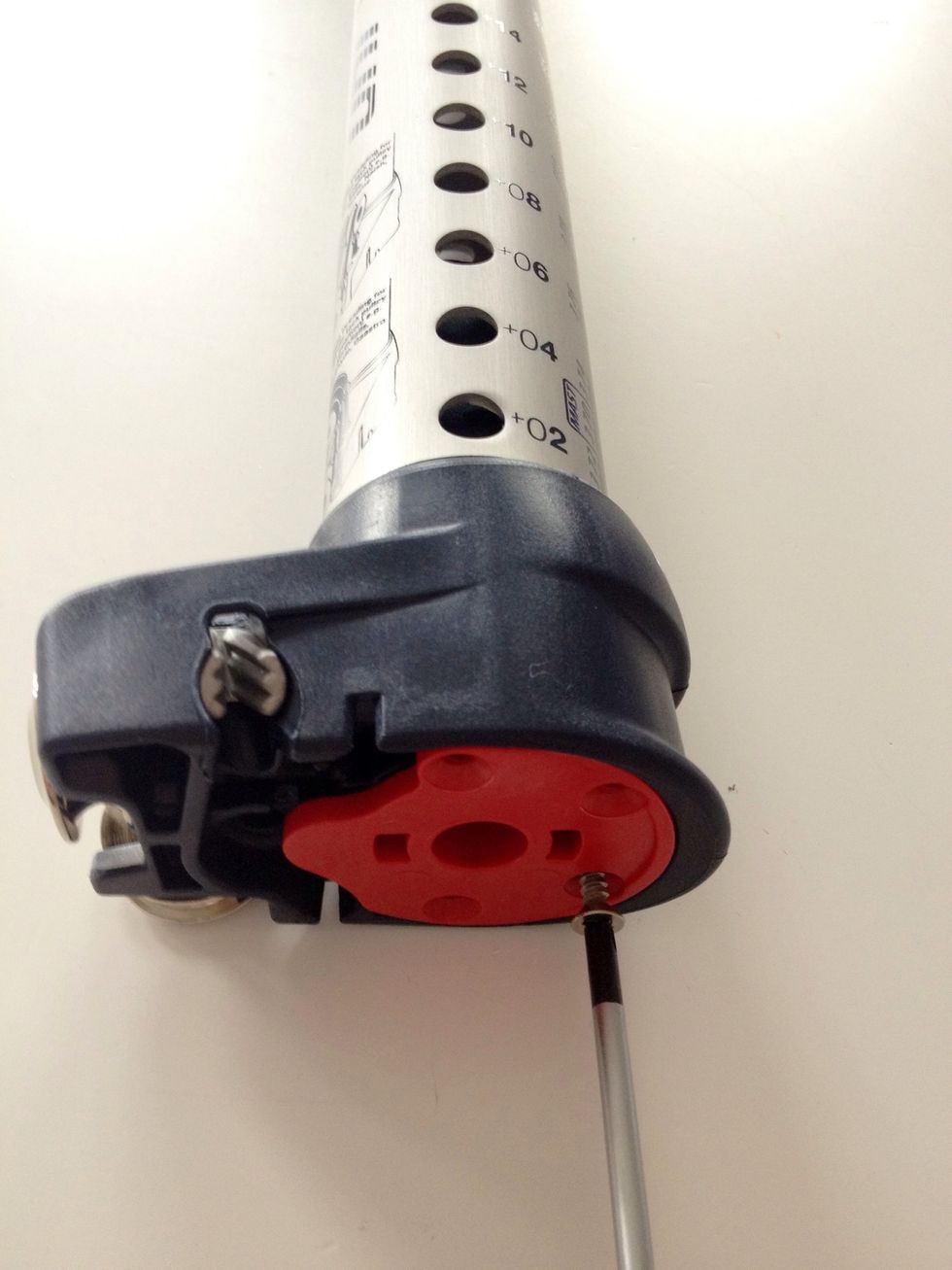 Use the Phillips-head screw-driver to remove the 4 screws fixing the red cup-insert