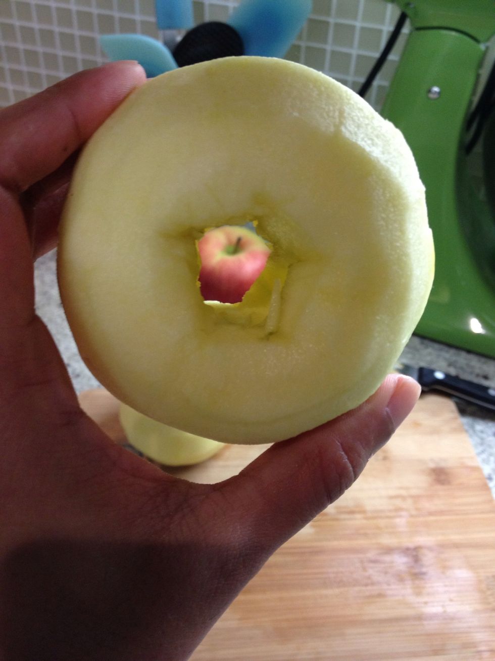 Use the point of your knife to pick out remaining seeds or casings that may still be inside. Gently tap the apple against the cutting board to get the bits out, and there you have your cored apple.