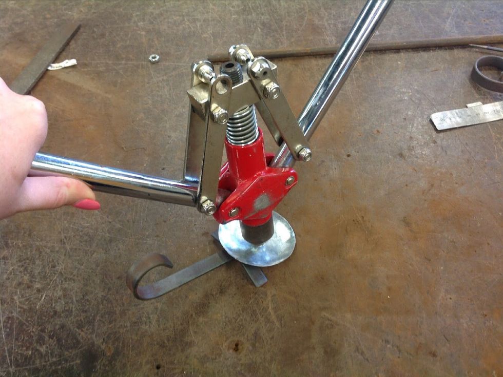 Use the pop rivet gun to pop rivet your candle holder in place