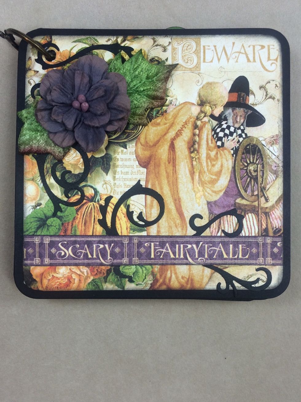 Use the remaining papers, die cuts, flowers and stickers to create mini album pages. This is my cover.
