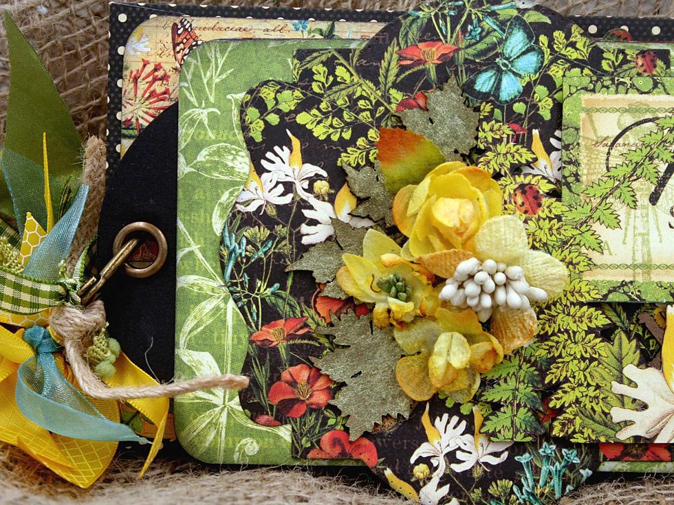 Use the ring that comes with the large tag album to assemble the mini placing a policy envelope between each tag.  Tie bits of ribbon onto the ring for a fun look.