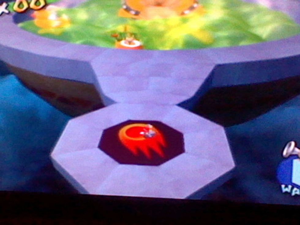 Use the rocket nozzle to ground pound one of these red things. There are 5 total.