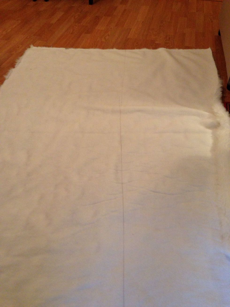 Use the ruler to draw a cut line. You can measure 24" three times along the fabric to help make a straight line.