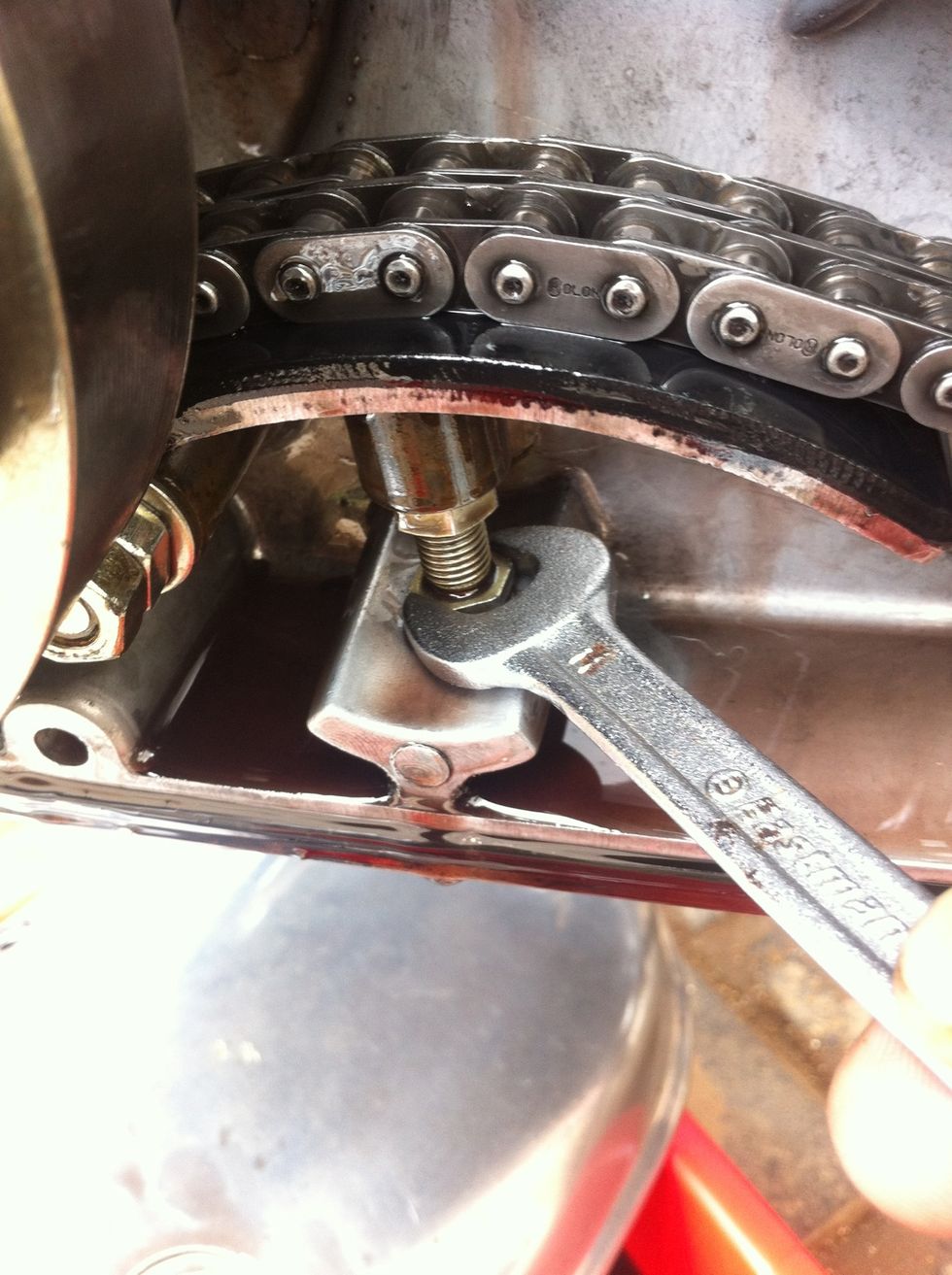 Use the same 11mm spanner to turn the bolt anti clockwise to increase tensioner height