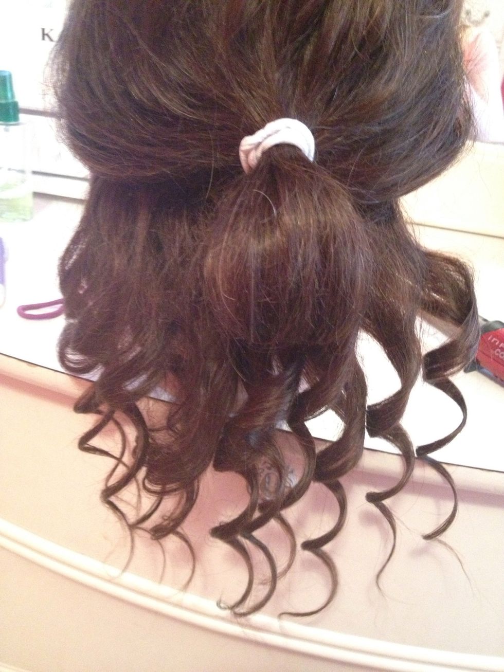 Use the same curling procedure to finish the other bottom section.