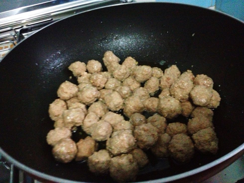 Use the same oil, fry the meatballs for about 1-1 1/2 mnts until get darker color. Set aside when done