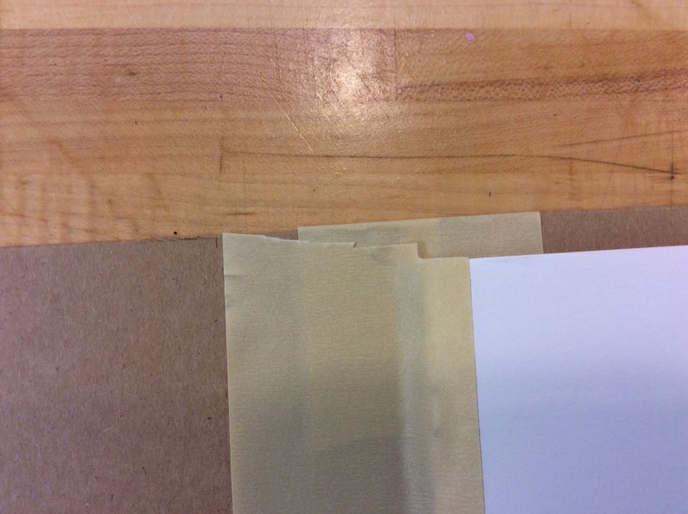 Use the scissors to cut off the extra tape at the top and bottom of your booklet.
