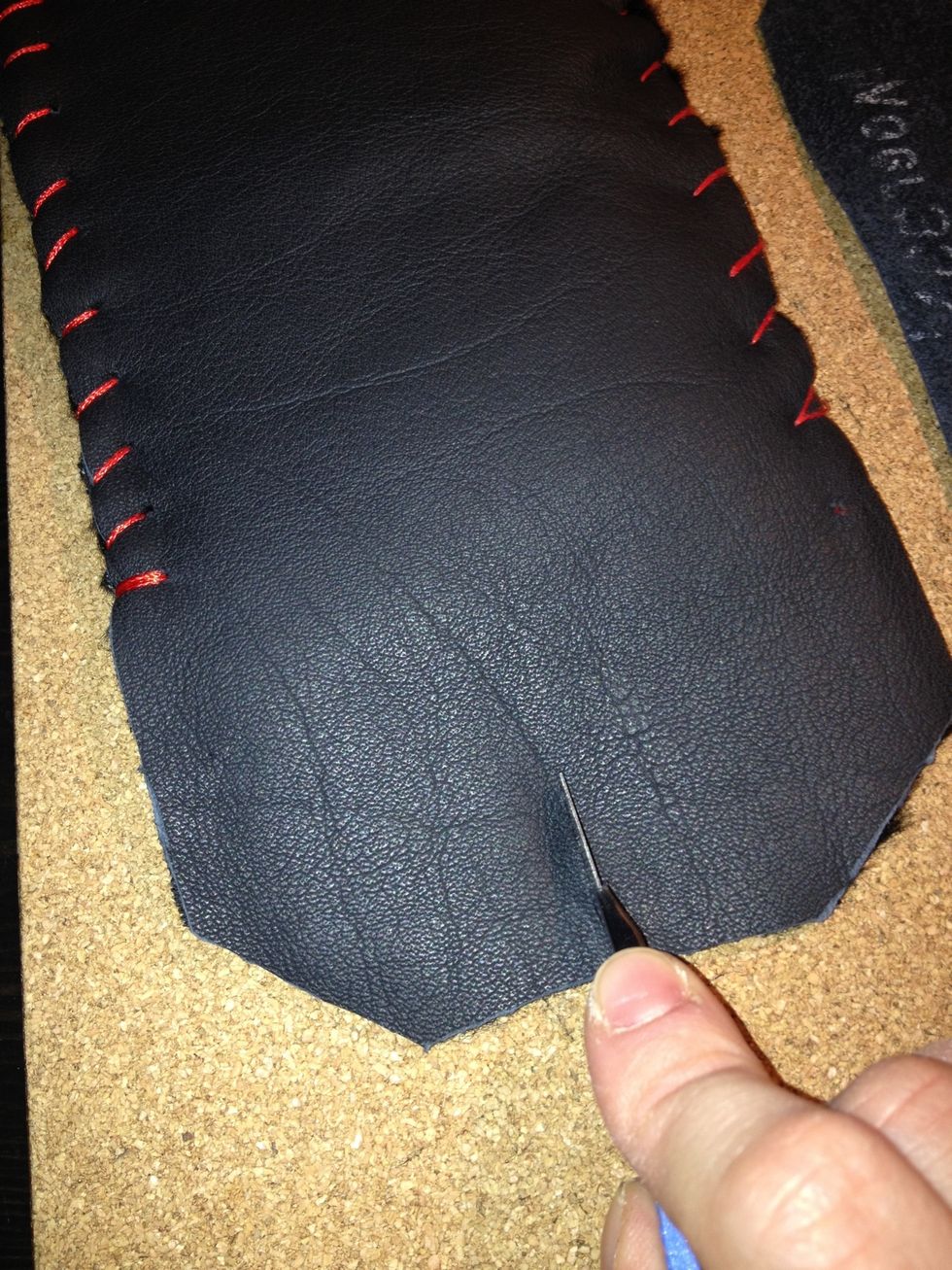 Use the sharp knife to shape the top flap however you like. Then make a small incision in the middle of the flap.