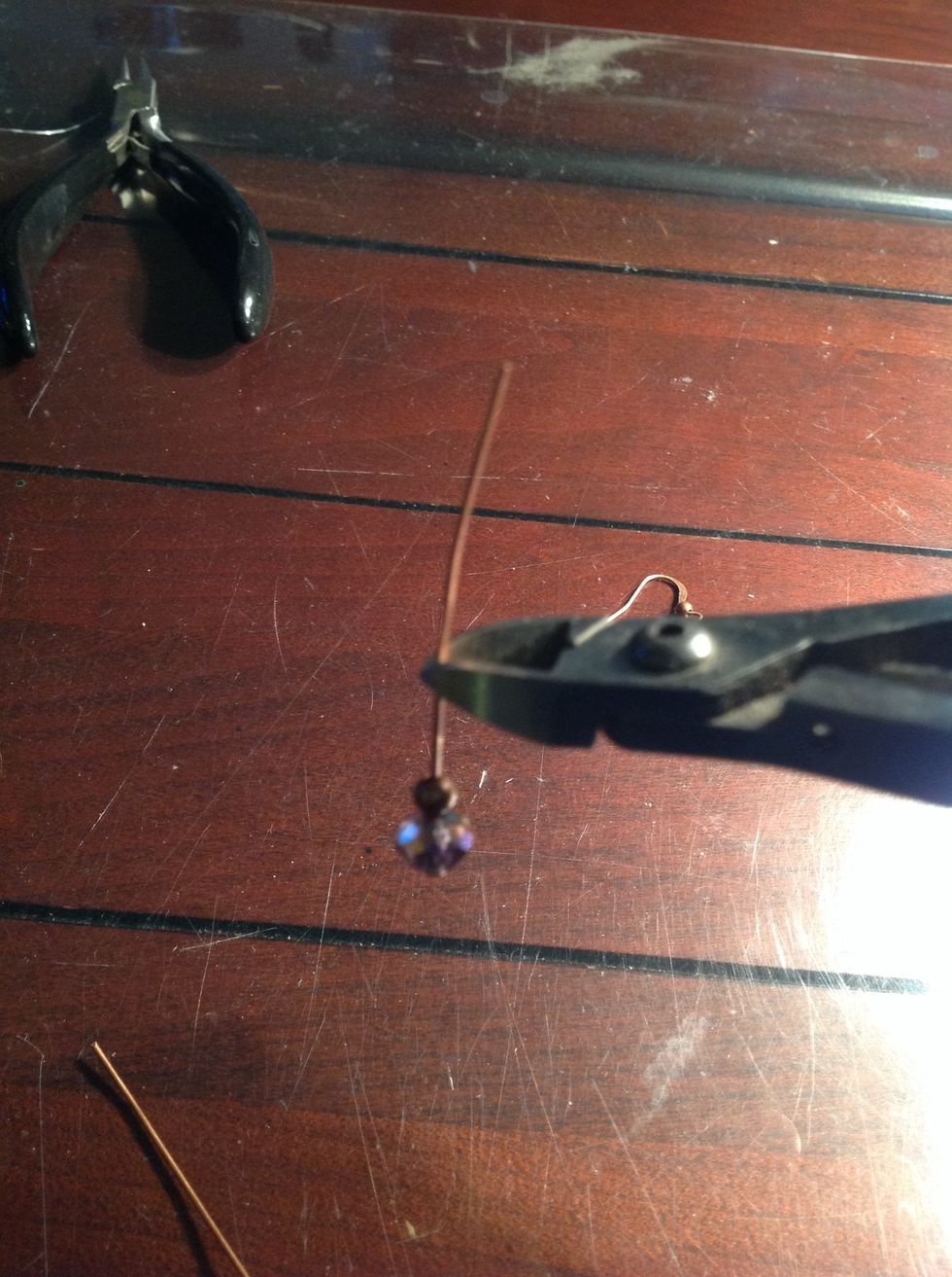 Use the side cutter pliers to cut the headpin to size (about 1/2" up from beads)