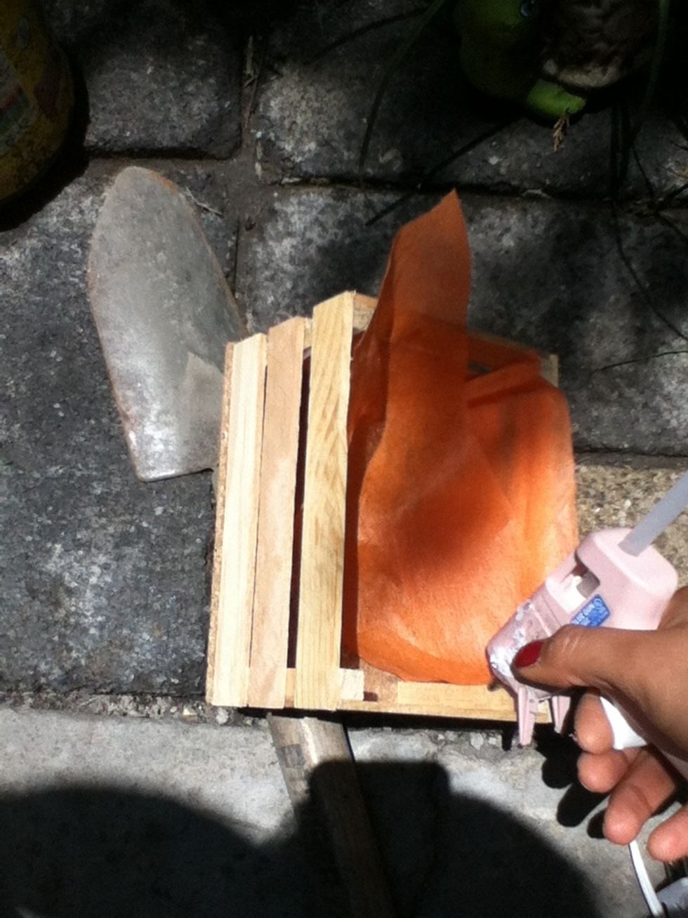Use the silicone to stick the fabric into the cage