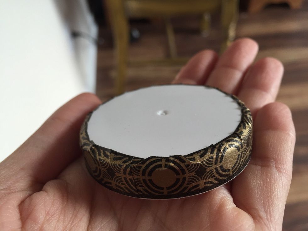 Use the smaller black and gold washi to cover the edges of the lid.