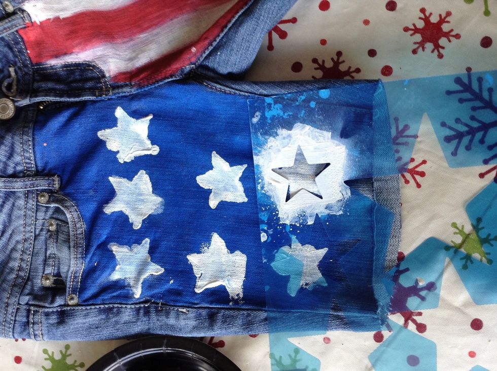 Use the stencil and spray paint to create stars. Mine are obviously not that good. Don't worry, we can fix this later.