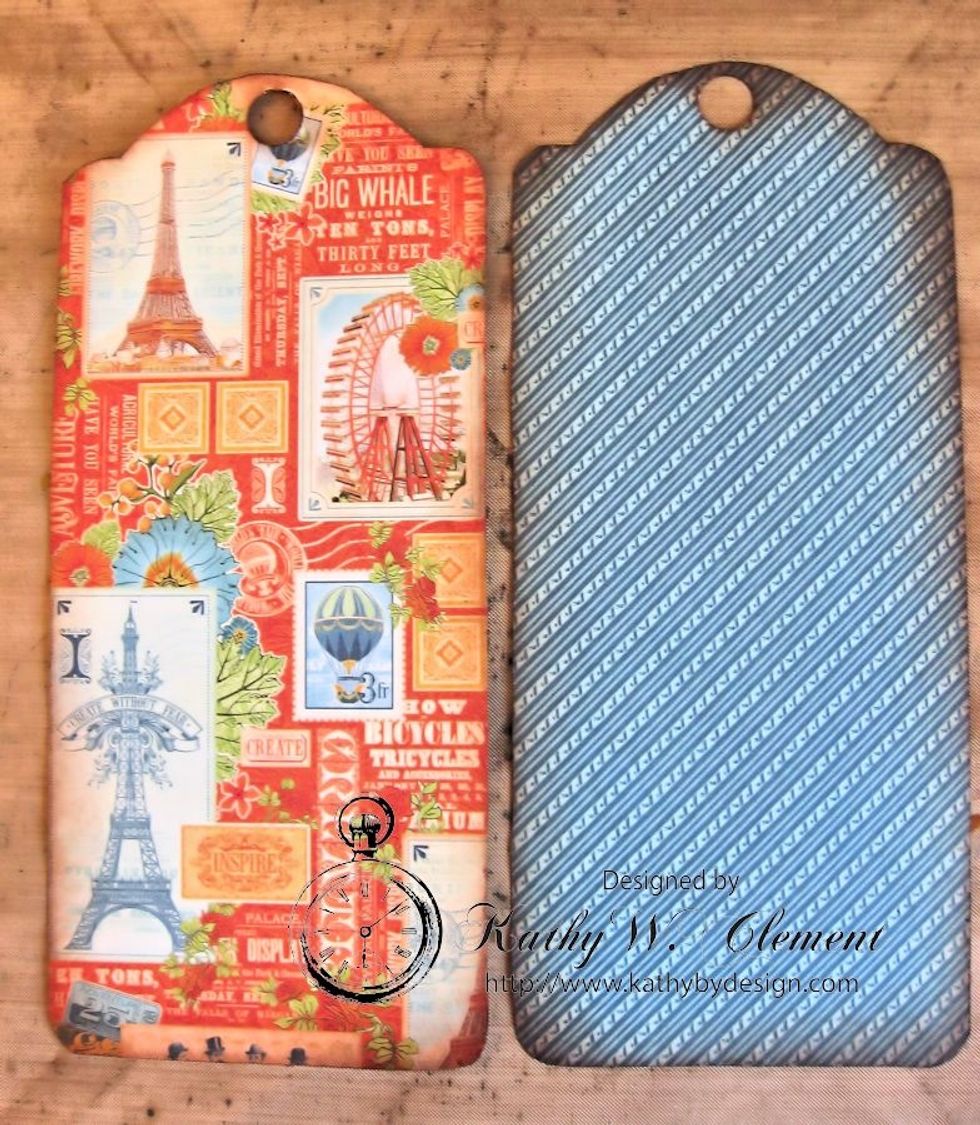 Use the tag as a template and trace around the front and back of Envision Expo 12x12 paper. Ink all the edges.  Use a 1/2" hole punch at the top of each tag.