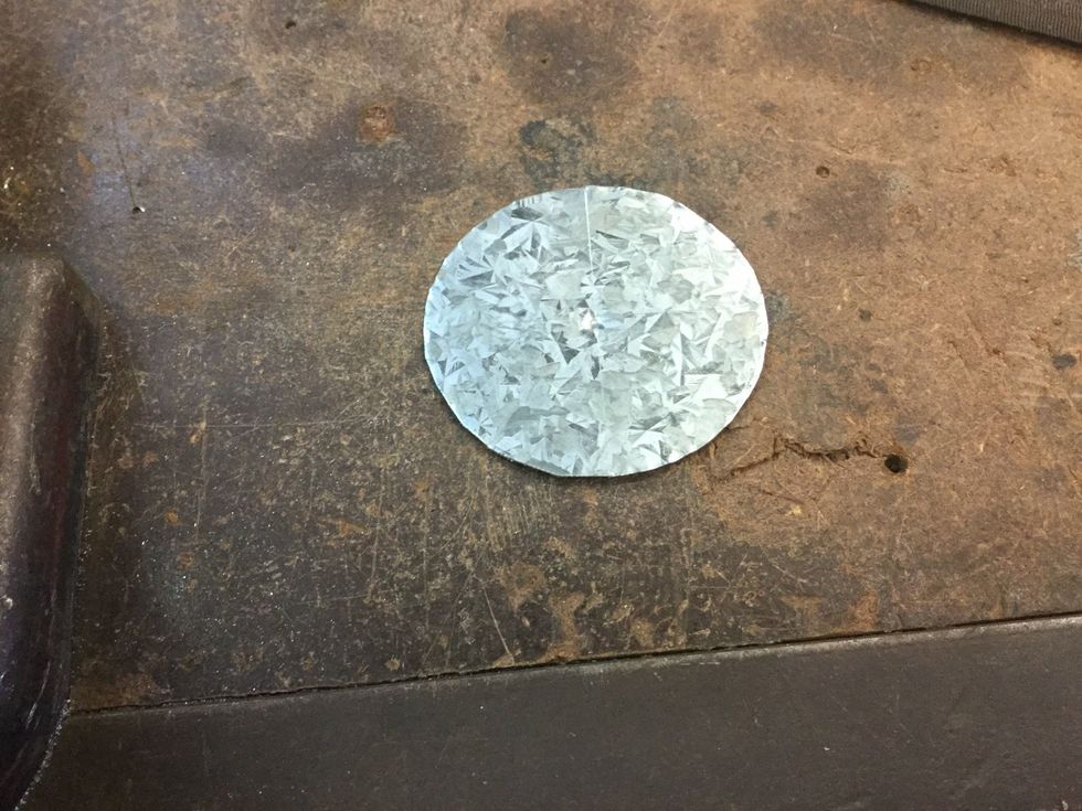 Use the tin snips to cut out the circle