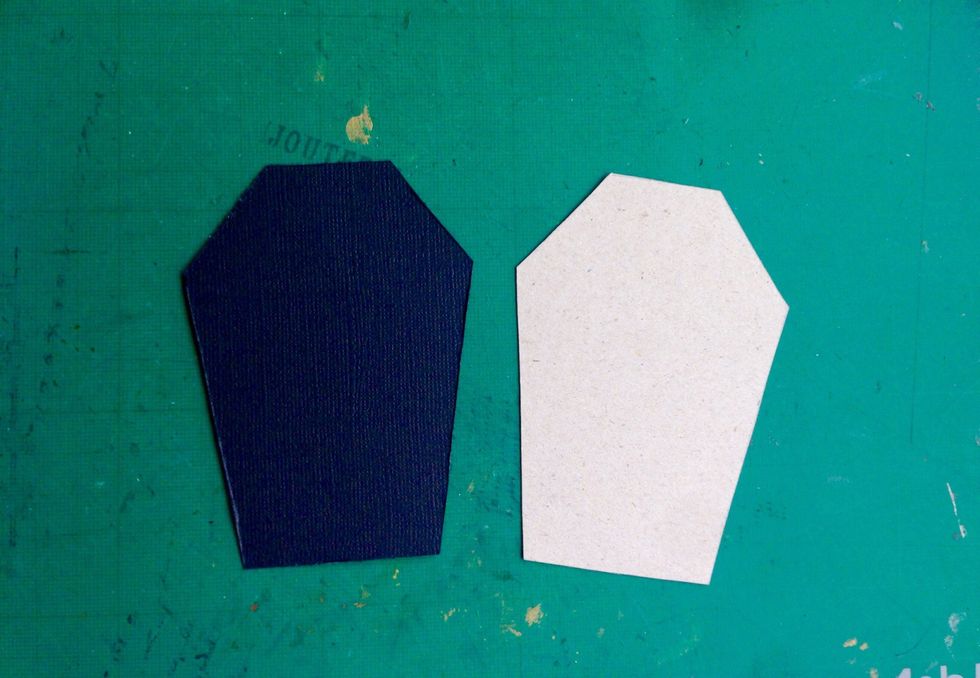 Use the tombcard template and trace one single card out onto a black cardstock... This will be the card for the pocket... And you are all done for embellishing!!!