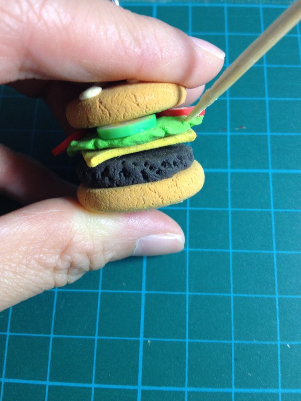 - Use the toothpick to move the green clay with curves to make it more alike cabbage.