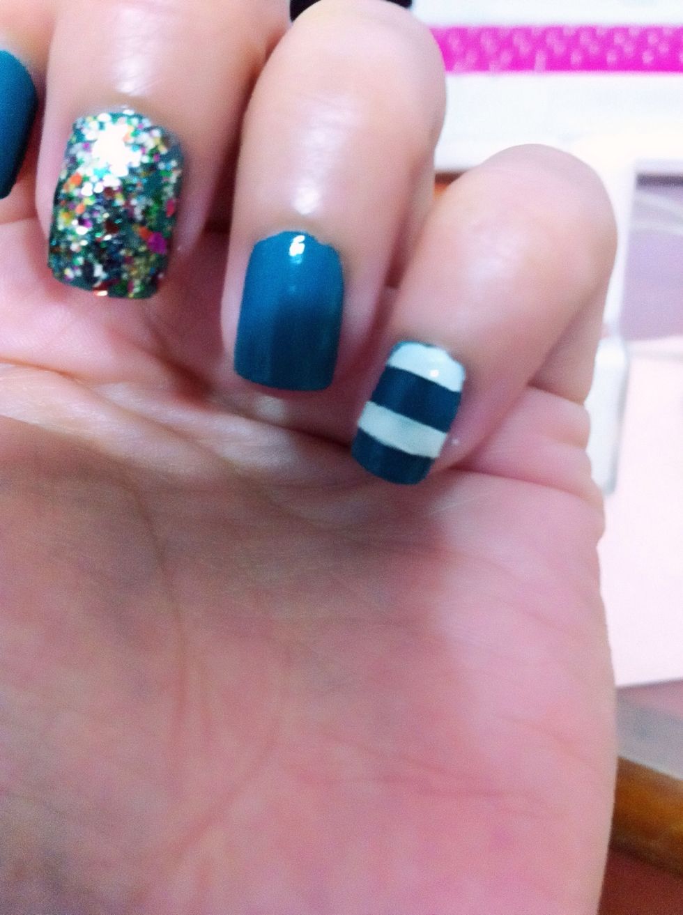 Use the tweezer.. And tear away the tape! Tadah!! Clean n straight stripes.. Wait abt 5 mins and then apply top coat.. And u're done!