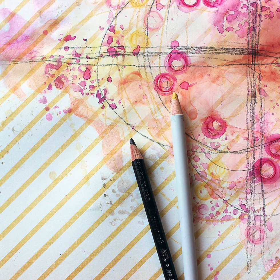 Use the watercolor pencils one more time and draw lines to guide the eye to the photo. Just a few lines, or circles, will suffice. Use a regular pencil also, if you like, for contrast.