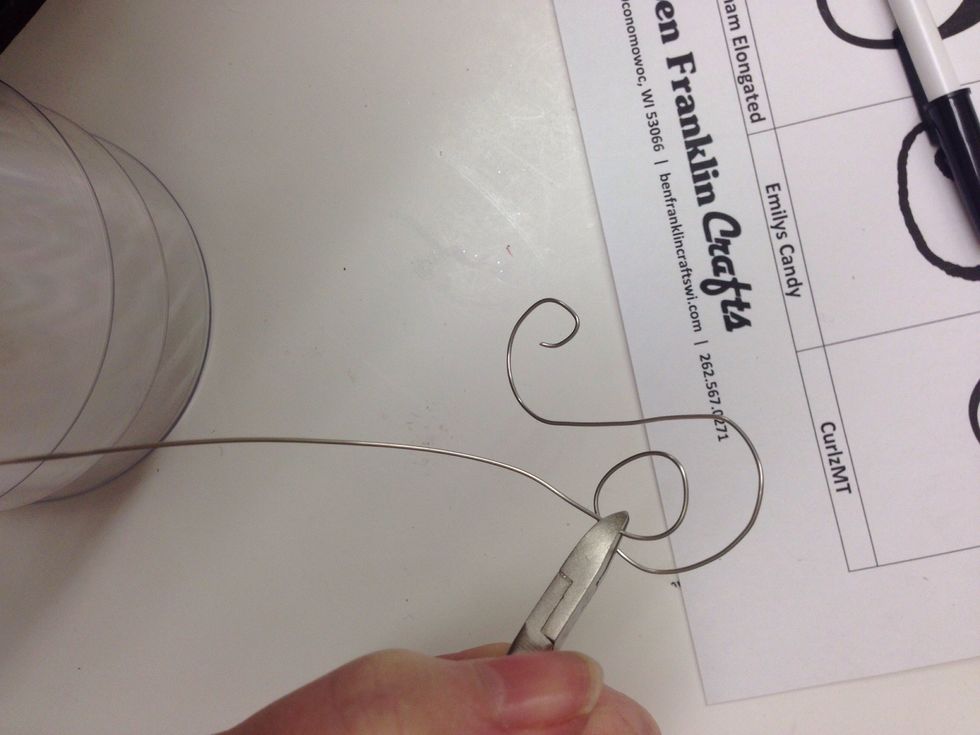 Use the wire cutter to trim off the extra wire when you are done shaping the hanger.