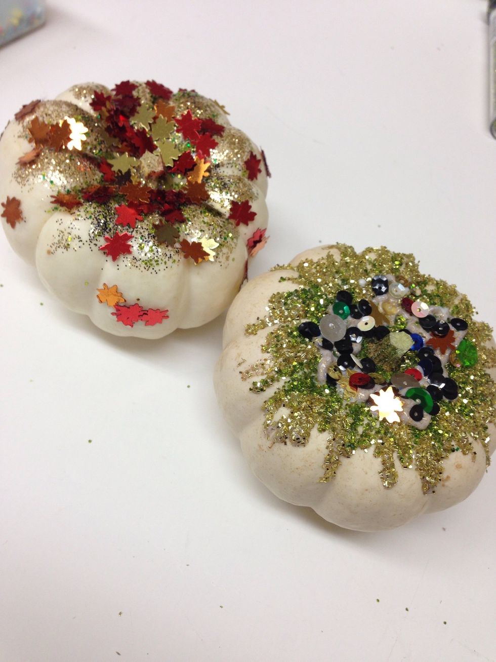 Use these fun little pumpkins for a sparkly Halloween decoration. Later, you can use a permanent marker to personalize the pumpkin as a place holder for your Thanksgiving table.